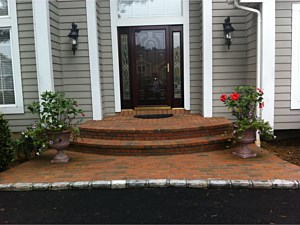 semi round clay brick 2 step stoop woodbury asphalt driveway brick landing